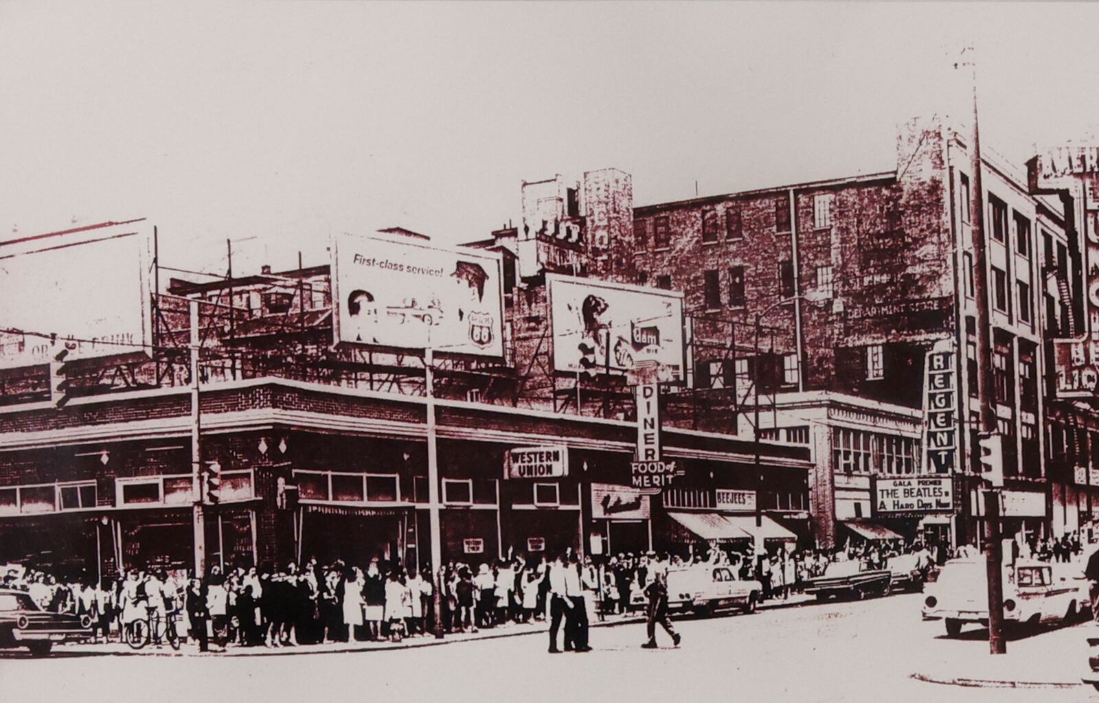 An old black and white picture of the line of people at the Regent Theater when The Beatles' A Hard Days Night was showing is part of John Lippolis' collection. BILL LACKEY/STAFF