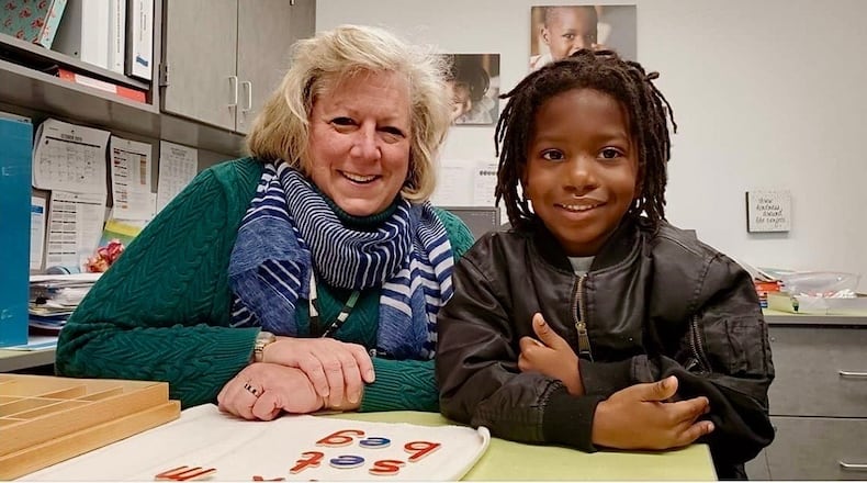 Meg Thomas, Principal at DPS River’s Edge Montessori School from 2019-2024, works with an eager Montessori scholar. MEG THOMAS/CONTRIBUTED