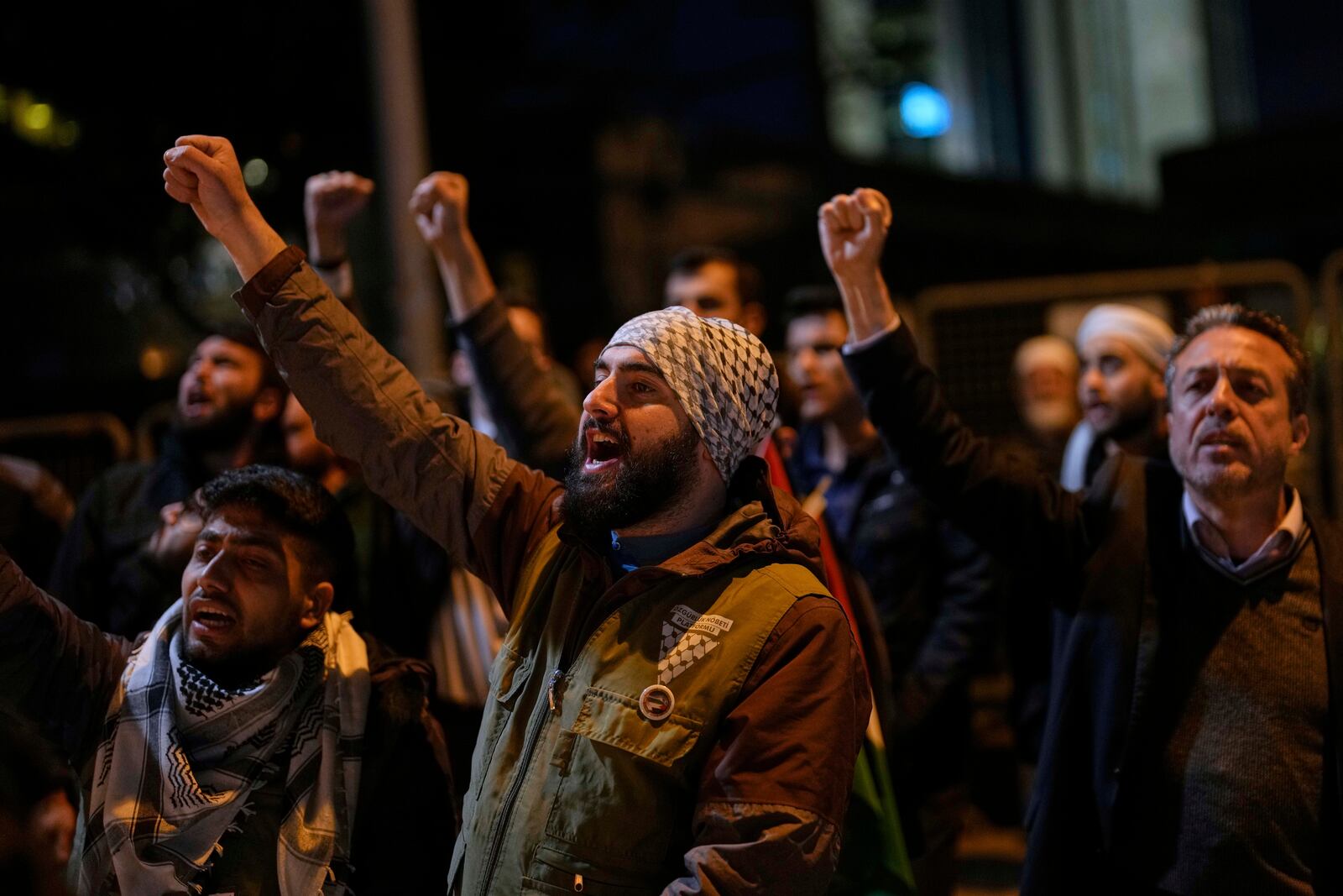People protest against an Israeli drone attack on a vessel carrying aid to Gaza in international waters off Malta, outside the Israeli consulate in Istanbul, Friday, May 2, 2025. (AP Photo/Khalil Hamra)