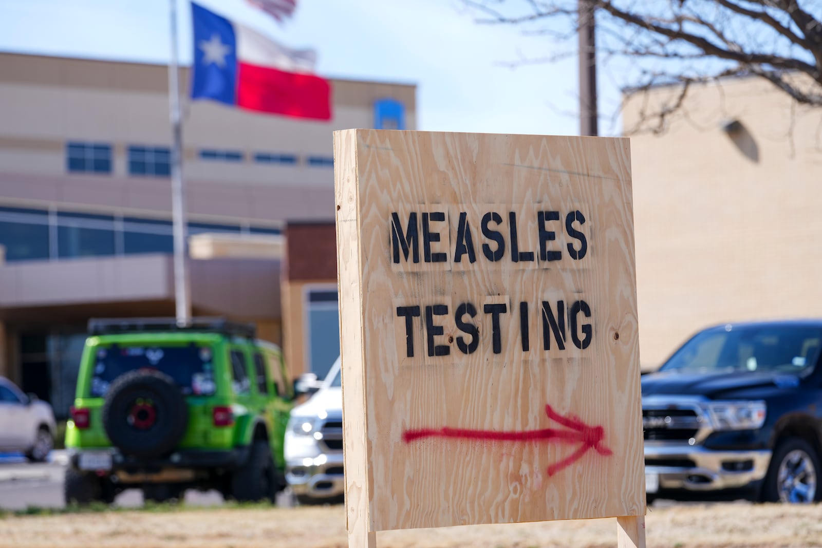 FILE - A sign is displayed outside the Seminole Hospital District offering measles testing, Feb. 21, 2025, in Seminole, Texas. (AP Photo/Julio Cortez, File)