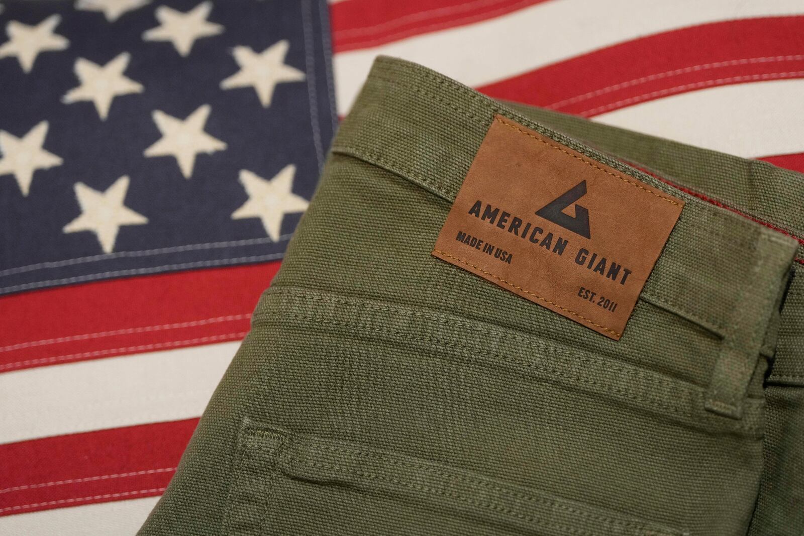 An American Giant logo tag is shown on pants at the company's showroom in San Francisco, Thursday, April 17, 2025. (AP Photo/Jeff Chiu)