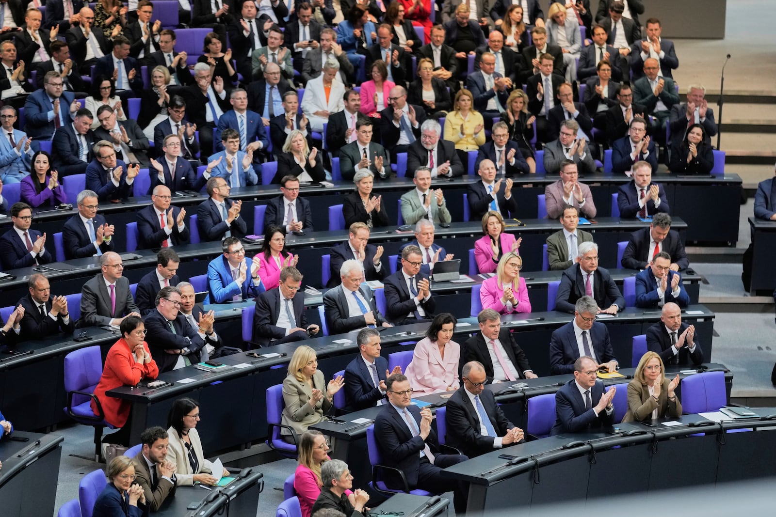 Leader of the Christian Democrats Friedrich Merz, third from right, listens to a debate iahead of a second round of vote at the German federal parliament, Bundestag, at the Reichstag building in Berlin, Germany, Tuesday, May 6, 2025. (AP Photo/Markus Schreiber)