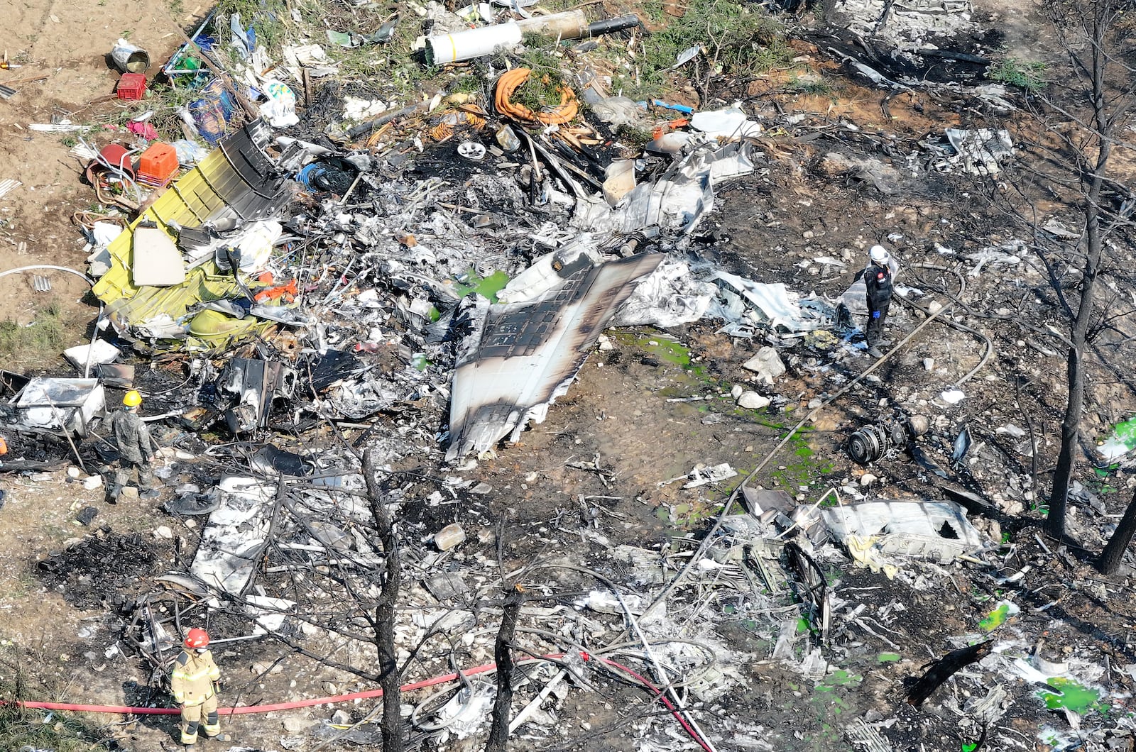 Debris of a South Korean navy plane is seen after it crashed in Pohang, South Korea, Thursday, May 29, 2025. (Run Kwan-shik/Yonhap via AP)