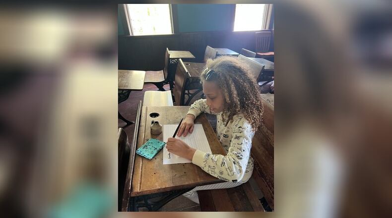 Pamela’s daughter, Jasmine, practices her penmanship at Carillon Historical Park during Homeschool Day. Many local venues offer special homeschool events throughout the year. CONTRIBUTED