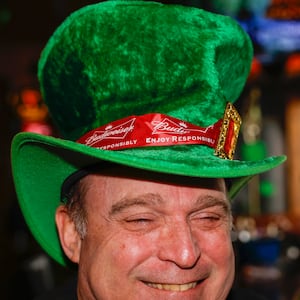 Brian Cutler shows off his Irish St. Patrick’s themed hat at O’Conners Irish Pub in Springfield. JOSEPH COOKE / STAFF