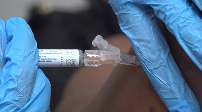FILE - A pharmacist gives a patient a flu shot in Miami on Sept. 9, 2025. (AP Photo/Daniel Kozin, File)