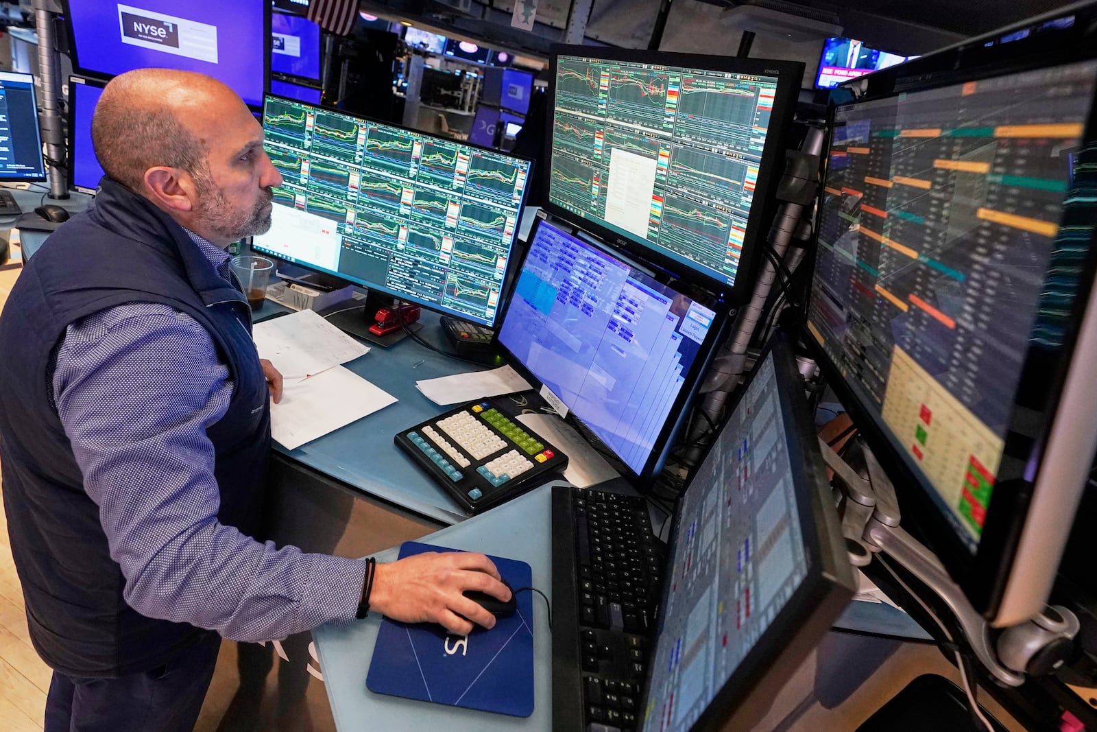 Specialist James Denaro works at his post on the floor of the New York Stock Exchange, Thursday, May 1, 2025. (AP Photo/Richard Drew)