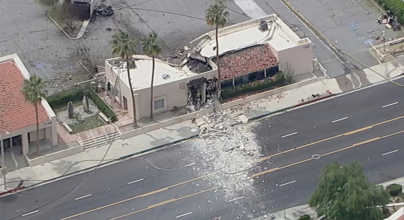 Debris covers the ground after an explosion on Saturday, May 17, 2025 in Palm Springs, Calif. (ABC7 Los Angeles via AP)