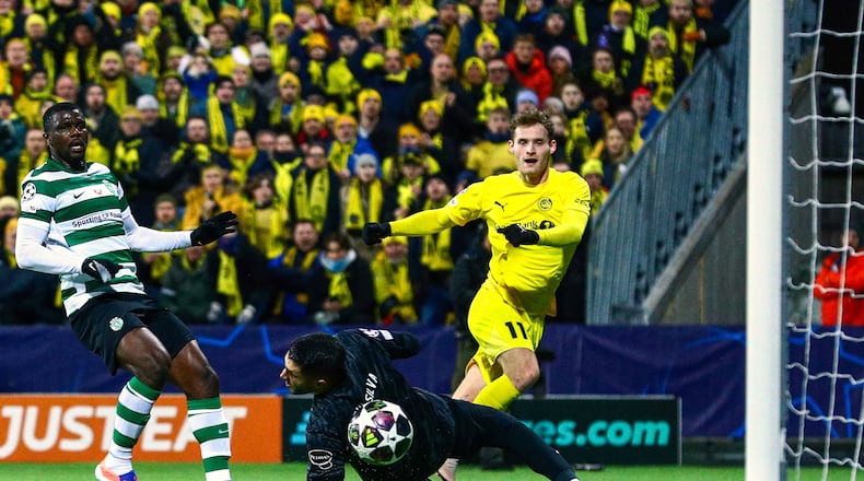 Bodo/Glimt's Ole Didrik Blomberg, right, scores their side's second goal of the game during the Champions League soccer match between Bodo/Glimt and Sporting Lisbon, in Bodo, Norway, Wednesday March 11, 2026. (Fredrik Varfjell/NTB Scanpix via AP)