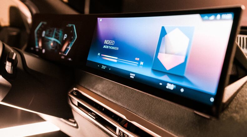 This photo provided by BMW shows the next-generation iDrive operating system and infotainment screen. BMW has removed this popular feature from several models. (BMW of North America via AP)