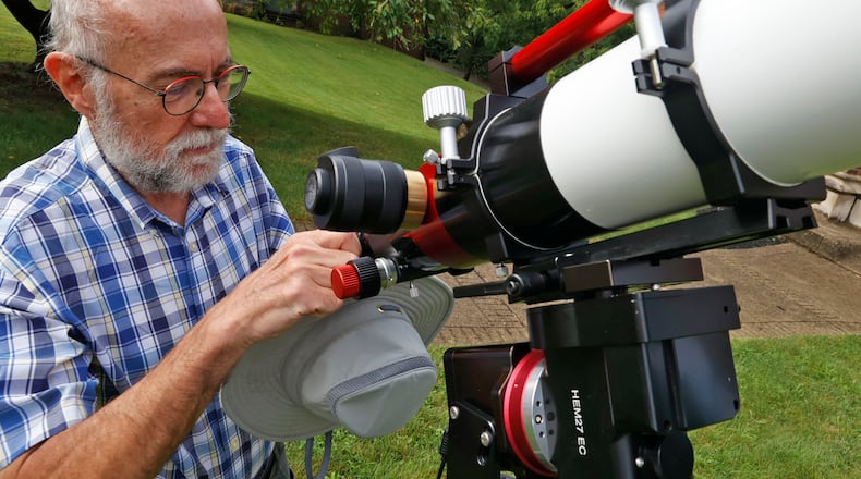Former Wittenberg University astronomer Dan Fleisch sets up a telescope at the university on Thursday, August 24, 2023. BILL LACKEY/STAFF