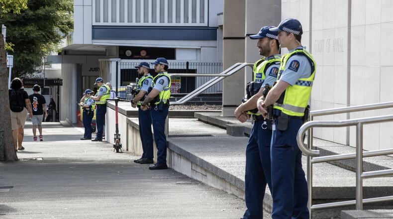Police stand in front of the Court of Appeal in Wellington, New Zealand, Monday, Feb. 9, 2026, where the court will hear an appeal from Brenton Tarrant. (Monique Ford/The Post/STUFF via AP)