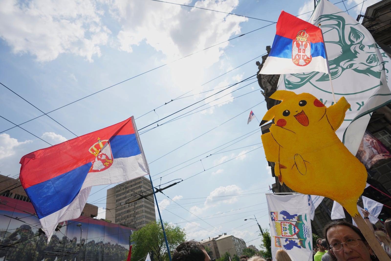 University students and people protest in front of the government building, six months after the deadly train station tragedy that sparked mass demonstrations against corruption, in Belgrade, Serbia, Thursday, May 1, 2025. (AP Photo/Darko Vojinovic)