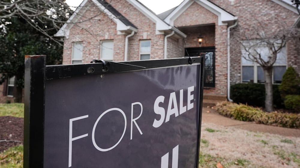 A "for sale" sign is posted outside a home in Nashville, Tenn., on Tuesday, Feb. 10, 2026. (AP Photo/George Walker IV)