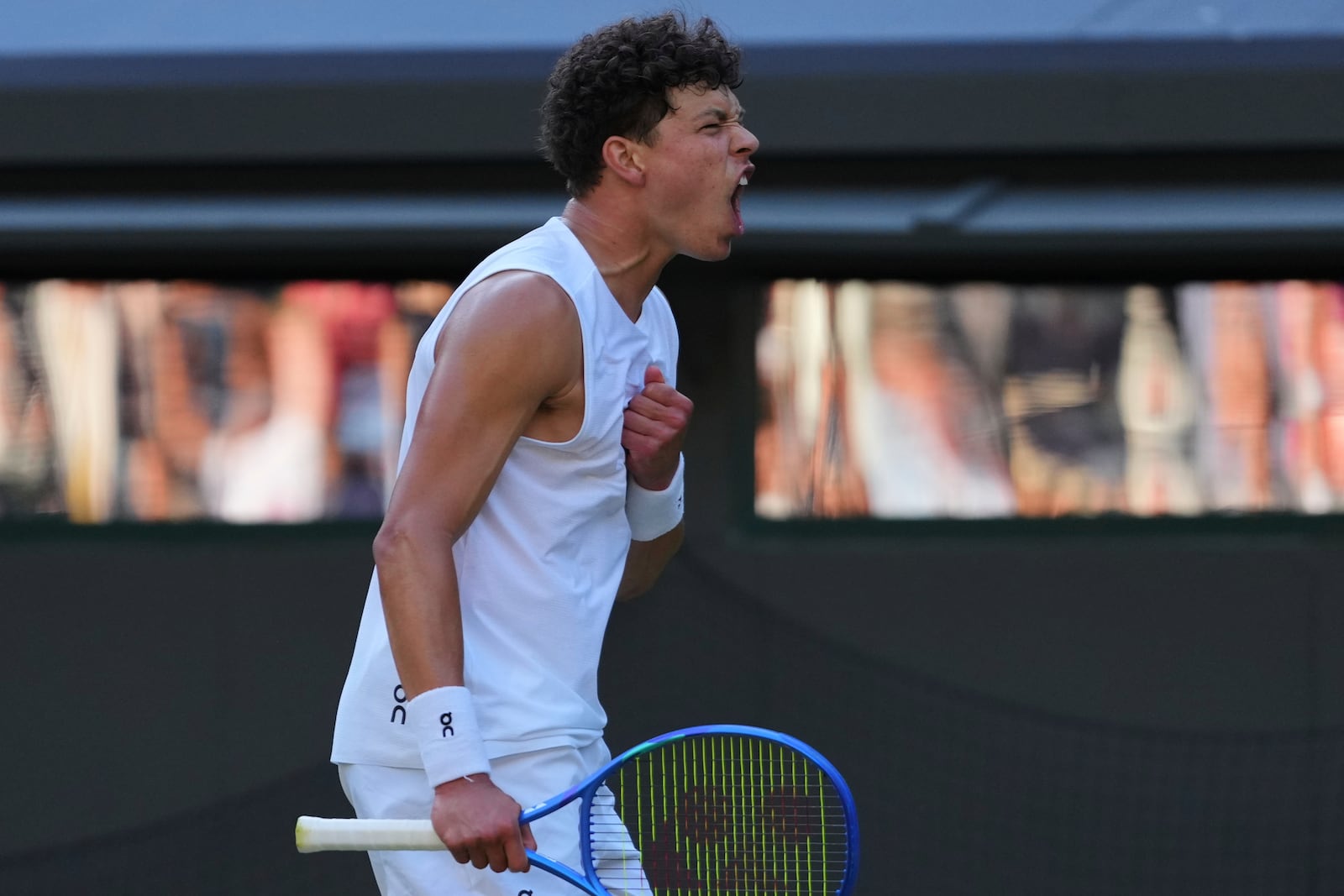 Ben Shelton of the U.S. celebrates winning the men's singles fourth round match against Lorenzo Sonego of Italy at the Wimbledon Tennis Championships in London, Monday, July 7, 2025.(AP Photo/Kirsty Wigglesworth)