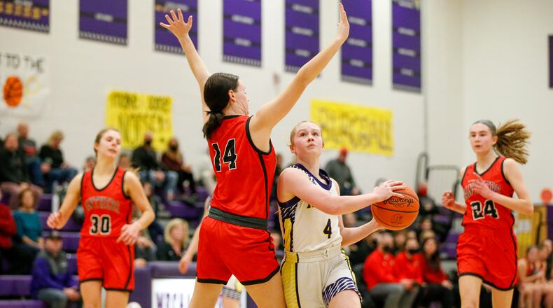 Cutline: Mechanicsburg High School sophomore Addie DeLong drives past Fairbanks' Anna Poling during their game on Wednesday night in Mechanicsburg. The Indians won 58-52, clinching a share of the Ohio Heritage Conference North Division title. CONTRIBUTED PHOTO BY MICHAEL COOPER