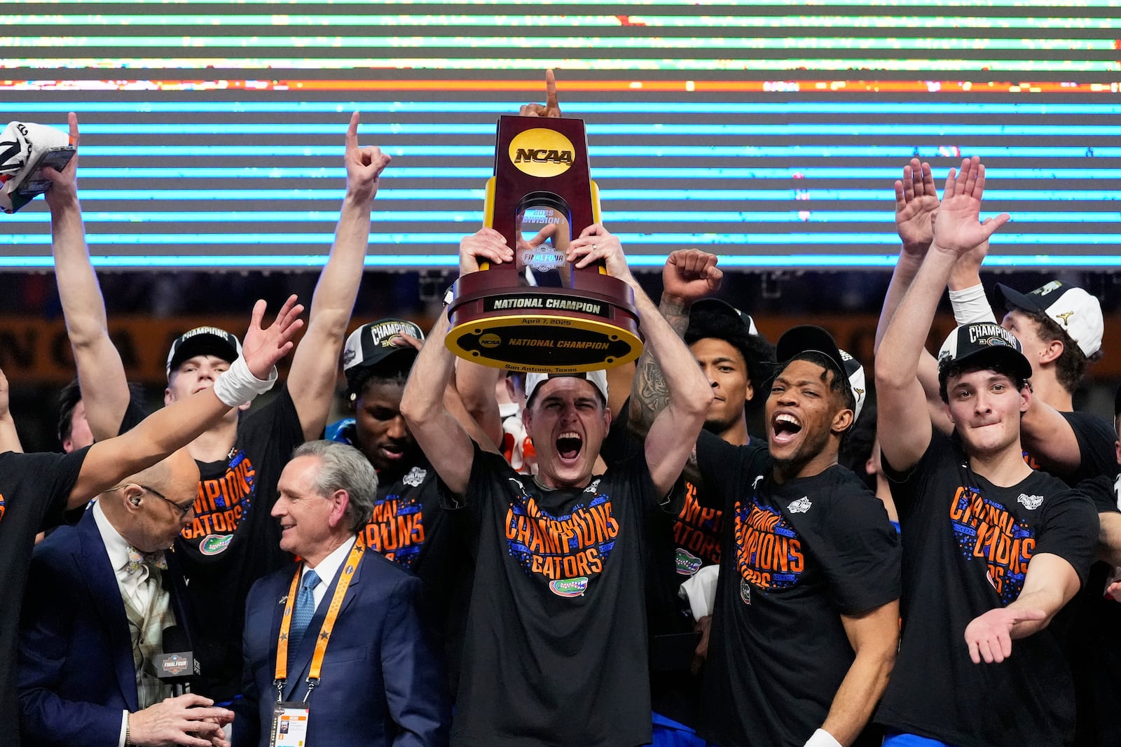 Florida celebrates with the trophy after their win against the Houston in the national championship at the Final Four of the NCAA college basketball tournament, Monday, April 7, 2025, in San Antonio. (AP Photo/Brynn Anderson)