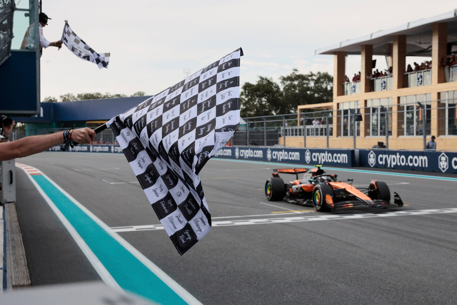 McLaren driver Oscar Piastri of Australia crosses the finish to win the Formula One Miami Grand Prix auto race Sunday, May 4, 2025, in Miami Gardens. Fla. (Shawn Thew/Pool Photo via AP)