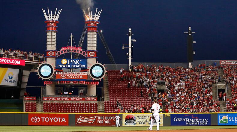 CINCINNATI, OH - MAY 15: General view as players and fans watch one of the outfield smokestacks on fire in the sixth inning of the game between the San Francisco Giants and Cincinnati Reds at Great American Ball Park on May 15, 2015 in Cincinnati, Ohio. The Giants defeated the Reds 10-2. (Photo by Joe Robbins/Getty Images)