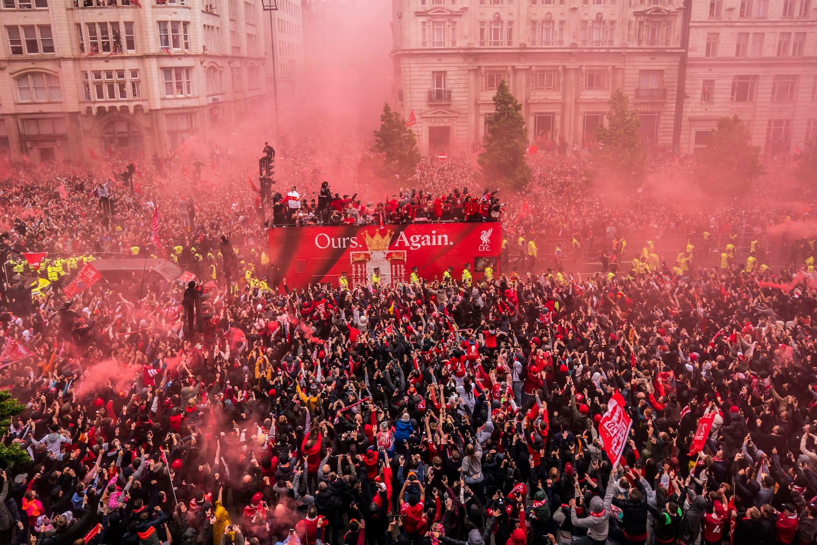 Crowds greet the Liverpool soccer team during their Premier League winners parade in Liverpool, England, Monday, May 26, 2025. (Owen Humphreys/PA via AP)