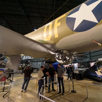 After Dark: Bombers & Brews happened at the National Museum of the U.S. Air Force on Saturday, Nov. 8, 2025. Hosted by the Air Force Museum Foundation, the ticketed after-hours 21 and up ticketed event featured food, games, trivia, caricature artist, cash bar, live music by 5 and beer samples from Fifth Street Brewpub, Heavier Than Air Brewing Co. and Warped Wing Brewing Company. Attendees had up close and personal encounters with the Memphis Belle (look-in), EC-121D Constellation (open aircraft), Boeing B-1B Lancer (open aircraft) and the Convair B-58 Hustler (look-in). TOM GILLIAM / CONTRIBUTING PHOTOGRAPHER