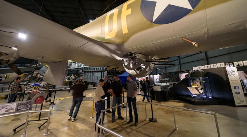 After Dark: Bombers & Brews happened at the National Museum of the U.S. Air Force on Saturday, Nov. 8, 2025. Hosted by the Air Force Museum Foundation, the ticketed after-hours 21 and up ticketed event featured food, games, trivia, caricature artist, cash bar, live music by 5 and beer samples from Fifth Street Brewpub, Heavier Than Air Brewing Co. and Warped Wing Brewing Company. Attendees had up close and personal encounters with the Memphis Belle (look-in), EC-121D Constellation (open aircraft), Boeing B-1B Lancer (open aircraft) and the Convair B-58 Hustler (look-in). TOM GILLIAM / CONTRIBUTING PHOTOGRAPHER