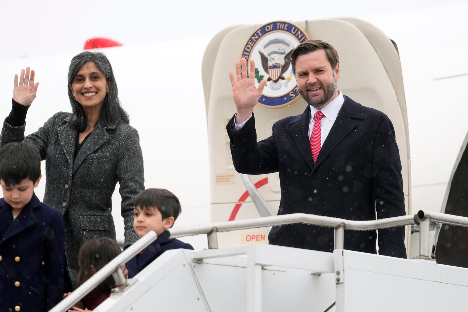 FILE - U.S. Vice President JD Vance and second lady Usha Vance, with their children Ewan, Vivek and Mirabel, wave as they arrive at the Munich airport in Munich, Germany, Feb. 13, 2025. (AP Photo/Matthias Schrader, File)