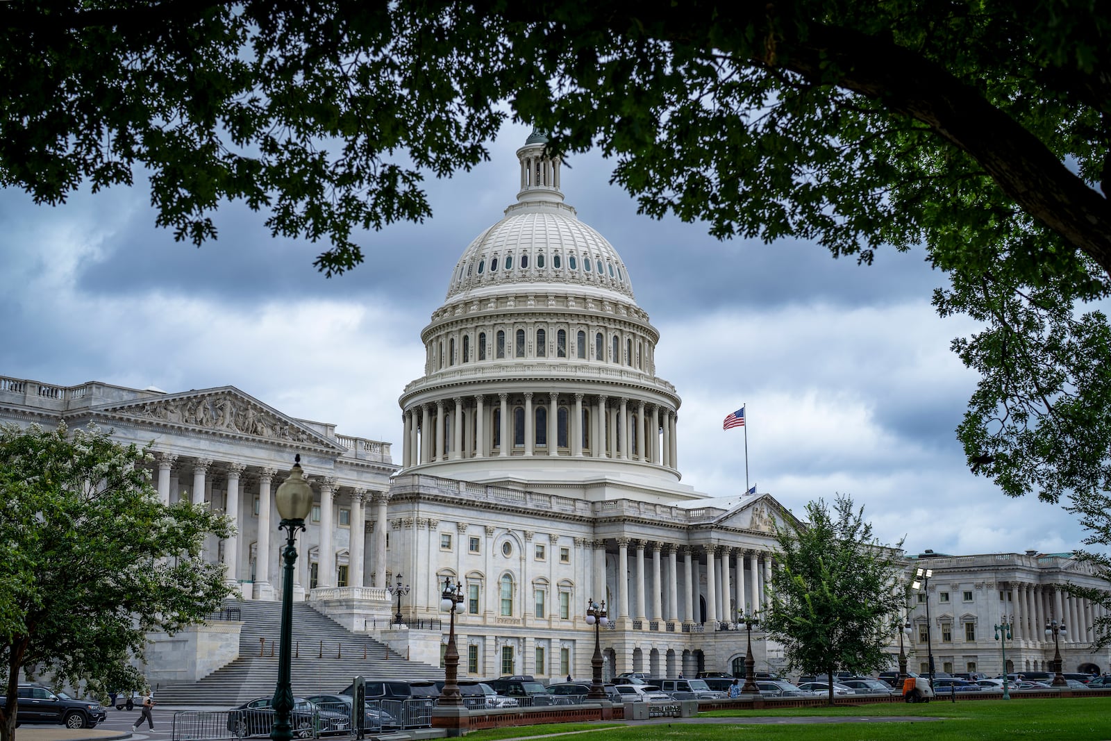The Capitol is seen under dark skies in Washington, Tuesday, July 15, 2025. (AP Photo/J. Scott Applewhite)