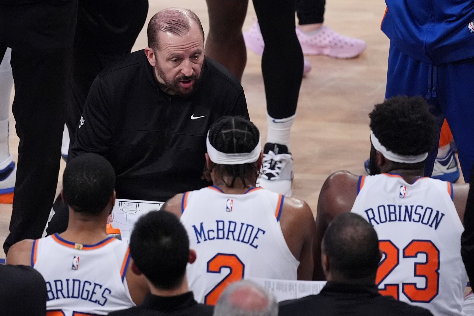 New York Knicks head coach Tom Thibodeau talks with players during a timeout during the second quarter of Game 2 of the NBA basketball Eastern Conference final against the Indiana Pacers, Friday, May 23, 2025, in New York. (AP Photo/Frank Franklin II)