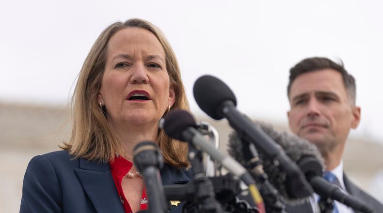 Arizona Attorney General Kris Mayes speaks to reporters as Oregon Attorney General Dan Rayfield listens outside the Supreme Court on Wednesday, Nov. 5, 2025, in Washington. (AP Photo/Mark Schiefelbein)