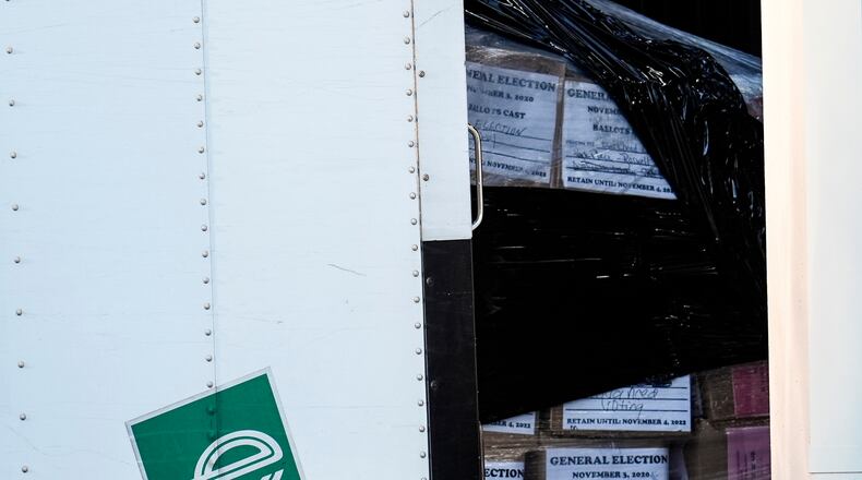 Georgia General Election 2020 ballots are loaded by the FBI onto trucks at the Fulton County Election HUB, Wednesday, Jan. 28, 2026, in Union City, Ga., near Atlanta. (AP Photo/Mike Stewart)