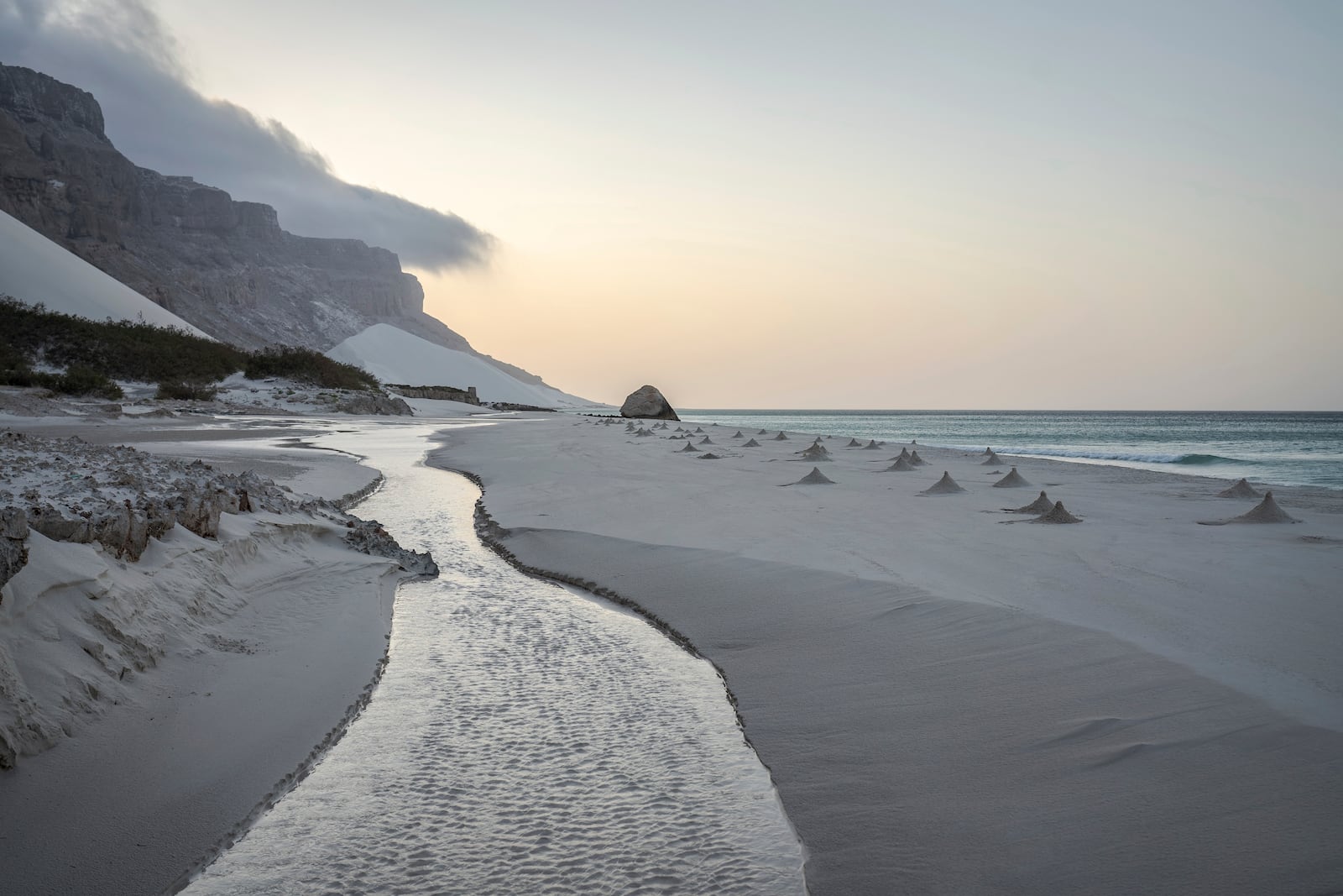 Ghost crab nests line the beach on the Yemeni island of Socotra on Sept. 22, 2024. (AP Photo/Annika Hammerschlag)
