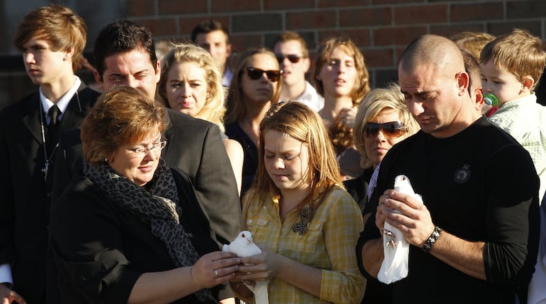 Hundreds from the community attended a combined public memorial service for Julianna Hawk, Sophie Kerrigan and Skylar Kooken at Bellbrook High School on Saturday, Nov. 10, 2012. The three girls were killed after the pickup truck they were riding in with three other teens crashed into a tree on Wagner Road. Barbara J. Perenic/Springfield News-Sun