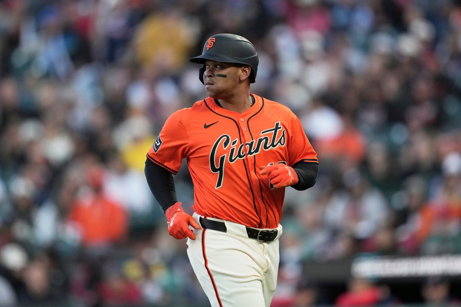 San Francisco Giants' Rafael Devers jogs to the dugout after grounding out against the Boston Red Sox during the first inning of a baseball game in San Francisco, Friday, June 20, 2025. (AP Photo/Jeff Chiu)