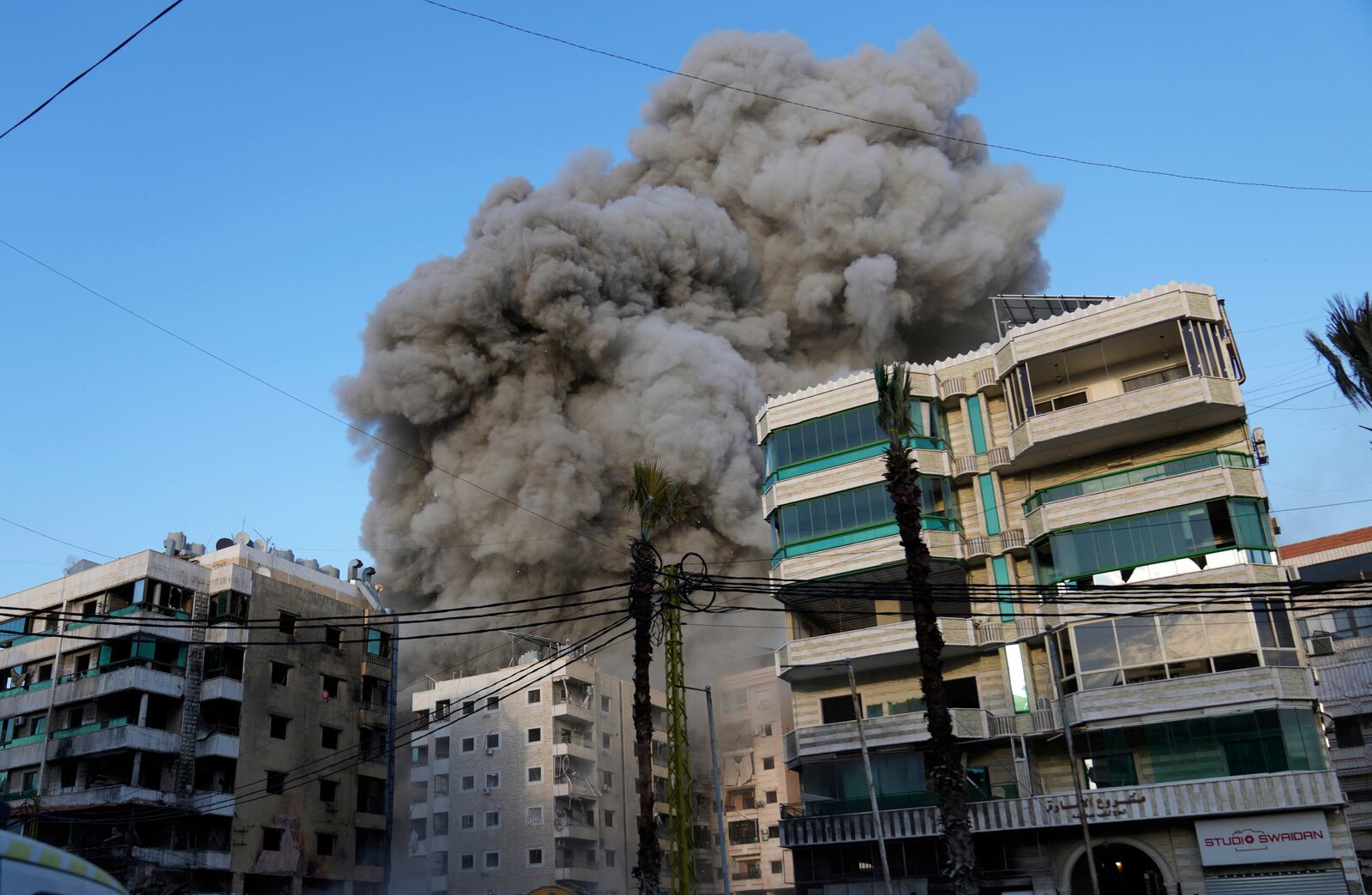 Smoke rise after an Israeli airstrike in Dahiyeh, the southern suburb of Beirut, Lebanon, Sunday, April 27, 2025. (AP Photo/Hussein Malla)