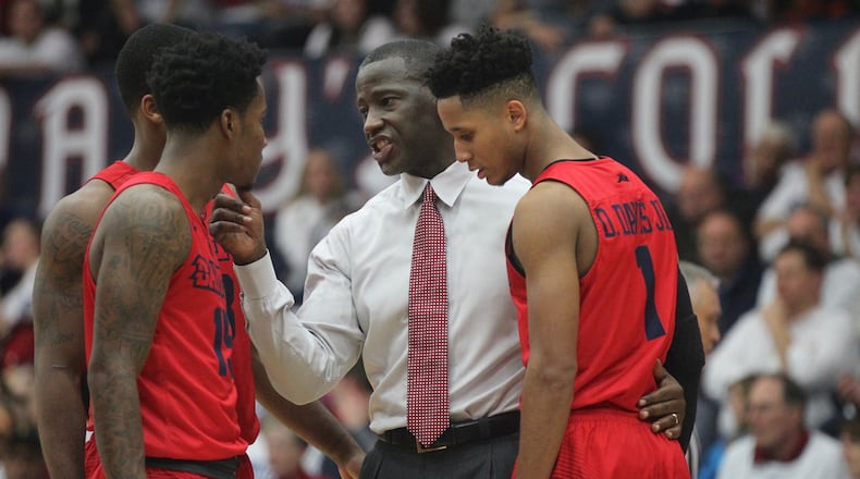 Dayton’s Anthony Grant huddles with his players during a game against Saint Mary’s on Tuesday, Dec. 19, 2017, at McKeon Pavilion in Moraga, Calif. David Jablonski/Staff