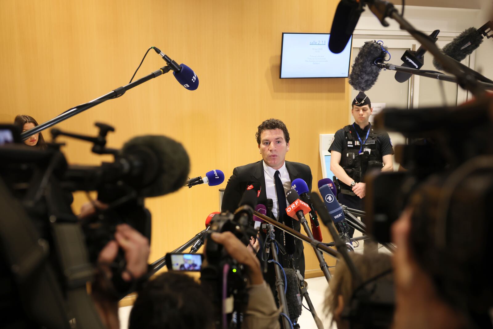 French actor Gerard Depardieu's lawyer Jeremie Assous speaks with the media after a verdict was delivered on accusations that the actor sexually assaulted two women who were working on a film with him in 2021, in Paris, Tuesday, May 13, 2025. (AP Photo/Thomas Padilla)