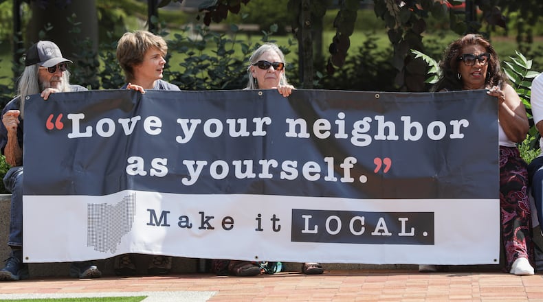 Hundreds of people turned out on Saturday, Aug. 2, on City Hall Plaza in downtown Springfield for "Love Thy Neighbor," which was organized by Springfield G92, a coalition of churches that says it is "committed to the safety and dignity of our Haitian neighbors and friends." Over a dozen people spoke, and two choirs performed. The organization said the goal of the event was to "project love, unity and support for our immigrant neighbors and community." BRYANT BILLING / STAFF