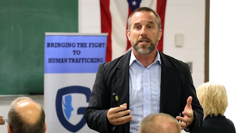 Jeff Tiegs, the COO of the Guardian Group, talks to members of the Springfield and Clark County law enforcement during a seminar on human trafficking Thursday at the Springfield Police Department. BILL LACKEY/STAFF