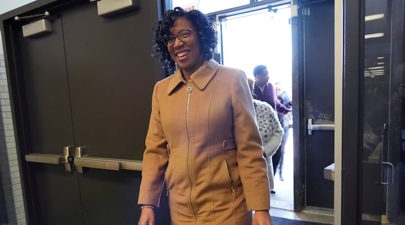 FILE - Chicago Treasurer Melissa Conyears-Ervin smiles as she walks into Marshall Metro high school to vote in Chicago, March 19, 2024. (AP Photo/Nam Y. Huh, File)