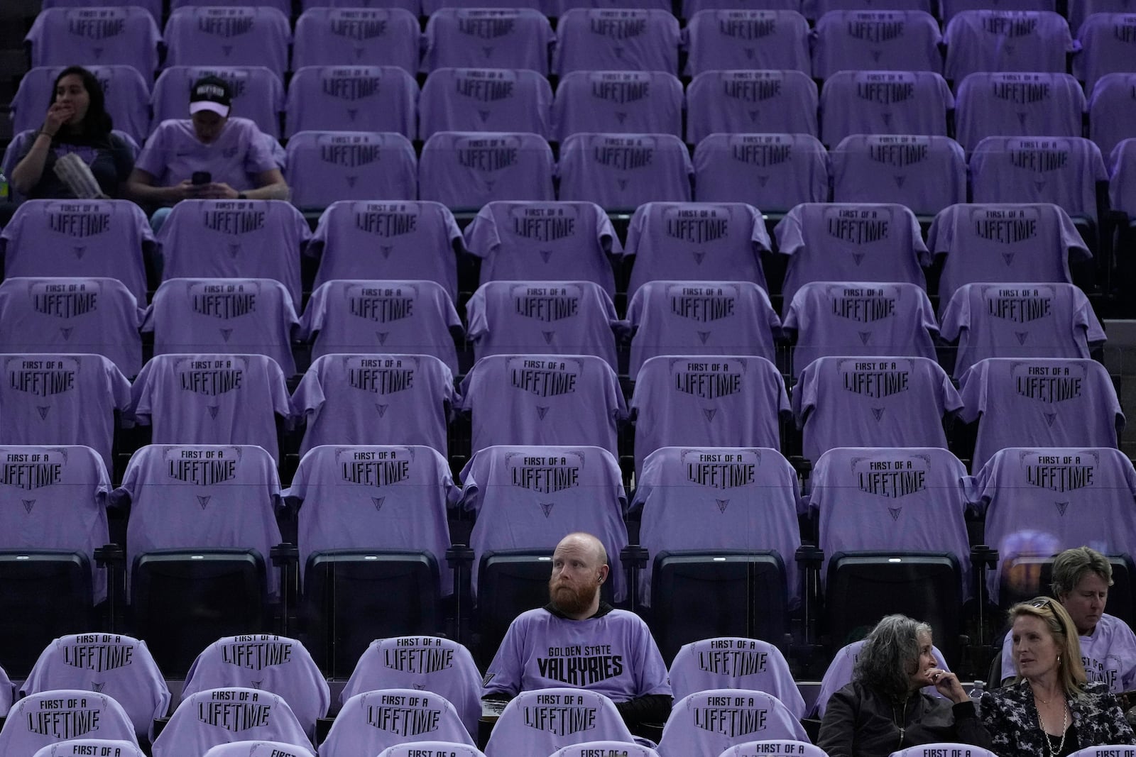 Golden State Valkyries t-shirts are placed on seats for fans at Chase Center before a WNBA basketball game between the Valkyries and the Los Angeles Sparks in San Francisco, Friday, May 16, 2025. (AP Photo/Jeff Chiu)