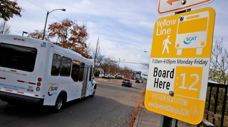 A SCAT bus drives past a bus stop along West Main Street in Springfield Monday, Nov. 6, 2023. BILL LACKEY/STAFF