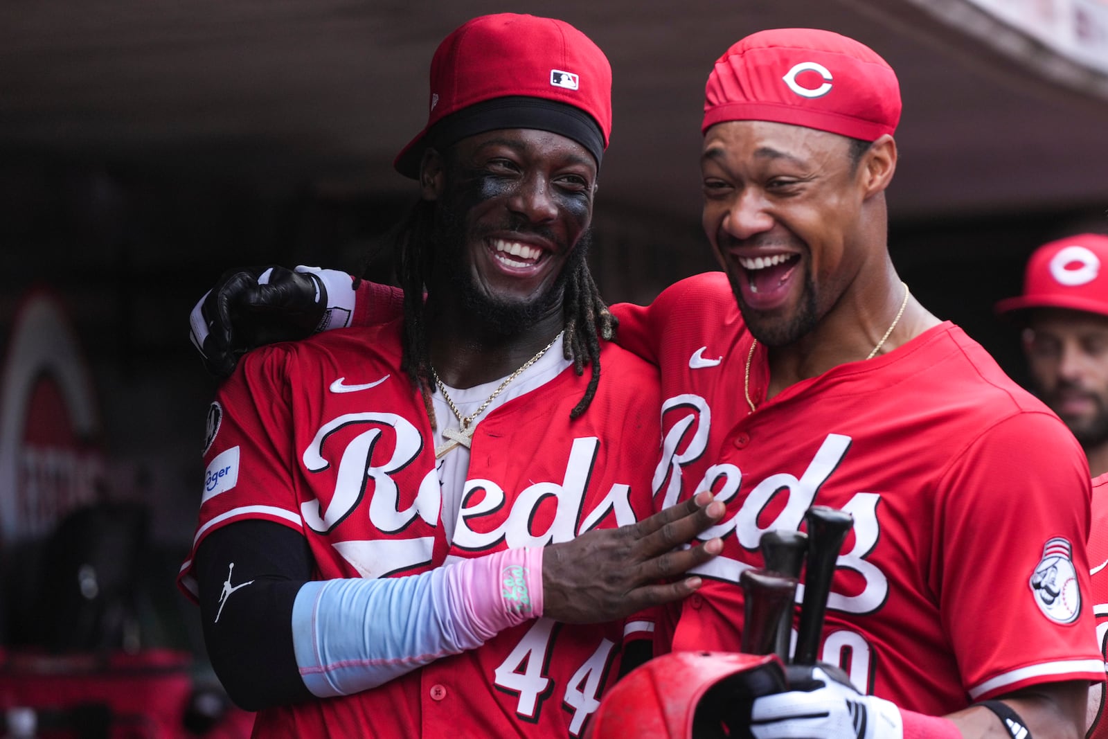 Cincinnati Reds' Elly De La Cruz and Will Benson celebrate their team's win after the 10th inning of a baseball game against the Milwaukee Brewers, Sunday, Aug. 17, 2025, in Cincinnati. (AP Photo/Grace Bradley)