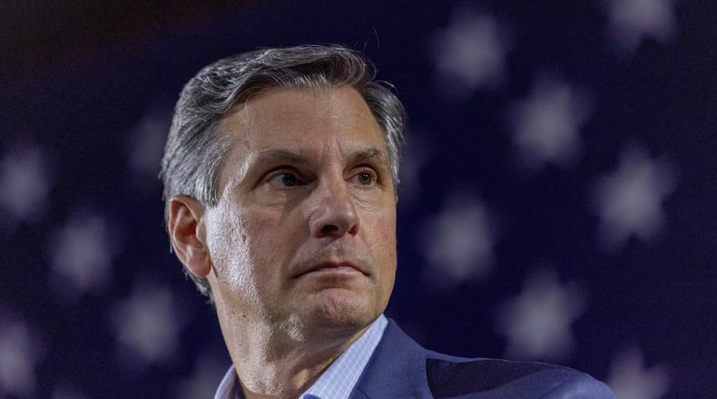 Derek Dooley, a Republican candidate for Senate in Georgia, listens to Georgia Gov. Brian Kemp, not pictured, speak during an Atlanta Young Republicans campaign event Thursday, Feb. 12, 2026, in Atlanta. (AP Photo/Alyssa Pointer)