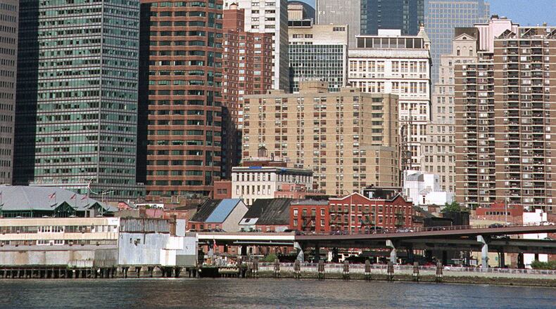 The south tower begins to collapse as smoke billows from both towers of the World Trade Center, in New York, in this Sept. 11, 2001.