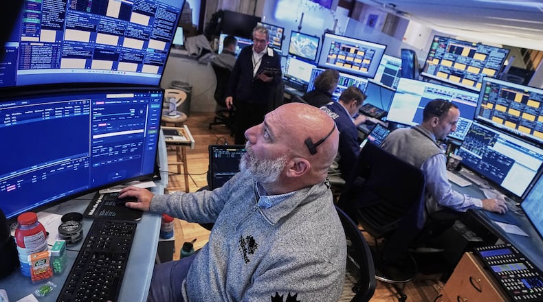 Trader Vincent Napolitono, foreground, works on the floor of the New York Stock Exchange, Thursday, Nov. 20, 2025. (AP Photo/Richard Drew)