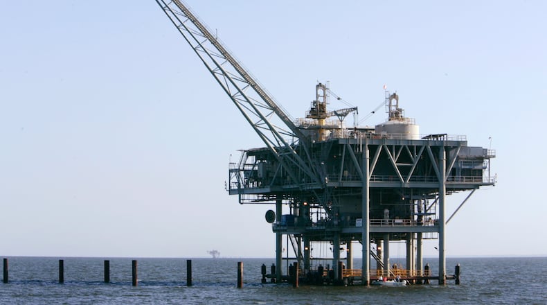 FILE - A natural gas platform is shown, April 13, 2006, off the coast of Fort Morgan, Ala. (AP Photo/Rob Carr, File)