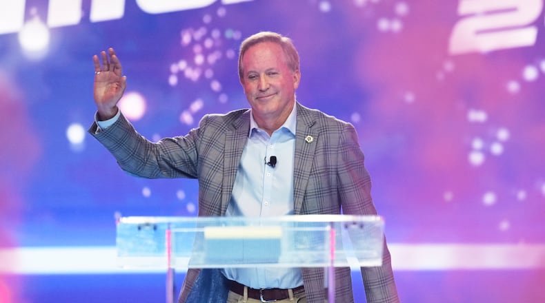 FILE - Texas Attorney General Ken Paxton takes the stage during Turning Point USA's AmericaFest 2025, Dec. 20, 2025, in Phoenix. (AP Photo/Ross D. Franklin, File)