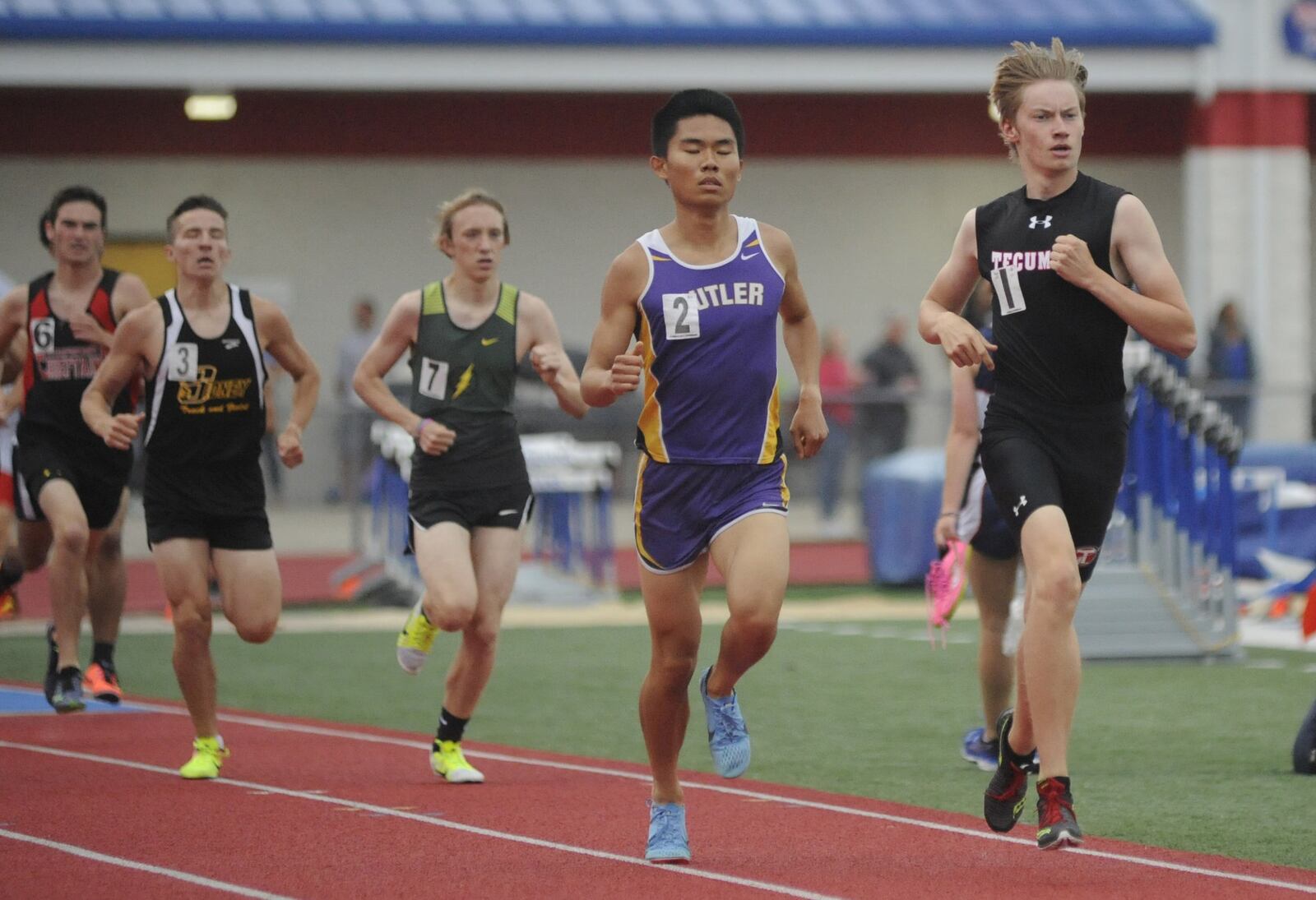 Tecumseh junior Stephen Mattingly (right) was second in the 800 in the D-I district track and field meet at Piqua on Friday, May 18, 2018. MARC PENDLETON / STAFF