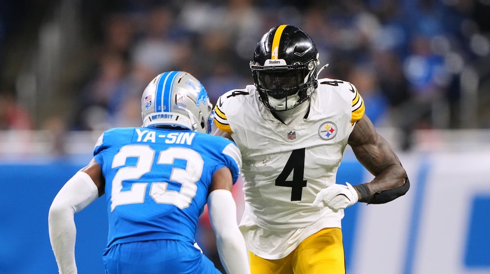 Pittsburgh Steelers' DK Metcalf, right, plays against Detroit Lions' Rock Ya-Sin during the second half of an NFL football game, Sunday, Dec. 21, 2025, in Detroit. (AP Photo/Ryan Sun)